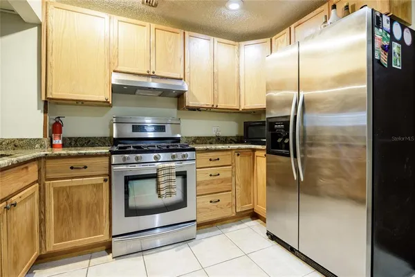 a view of a livingroom with a wooden & stove