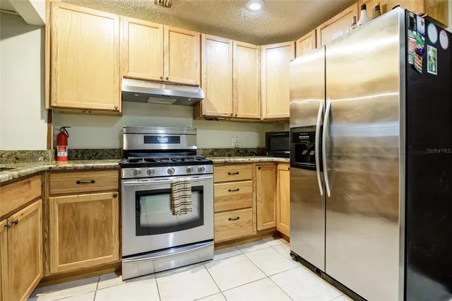 a view of a livingroom with a wooden & stove