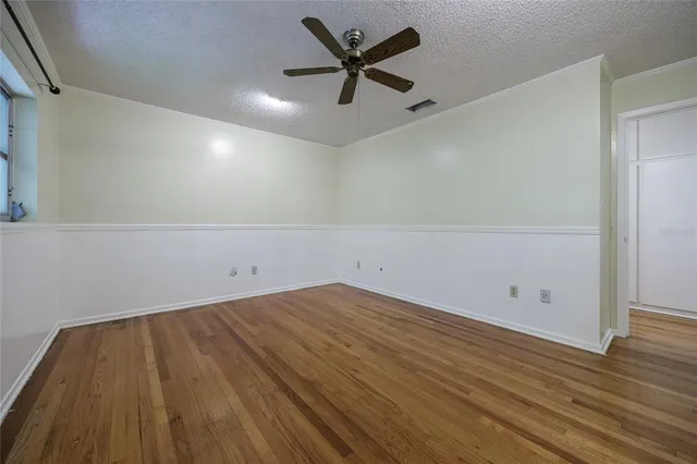 a view of a house with backyard and balcony