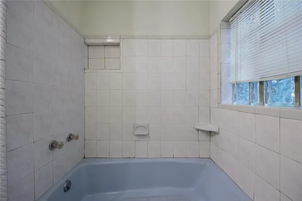 a view of a house with backyard and balcony