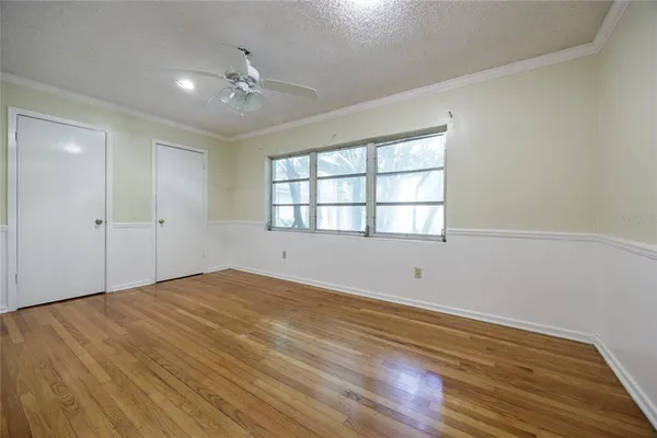 front view of a house with a tree