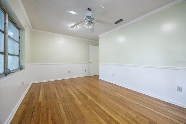 an aerial view of a house with a yard and garden