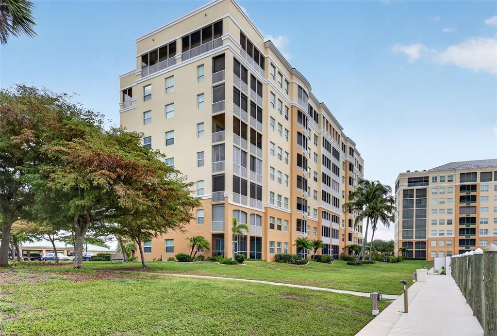 2060 Matecumbe Key Road, Unit 2506 Punta Gorda, FL 33955 - Photo 32 of 38 a view of a building with a yard