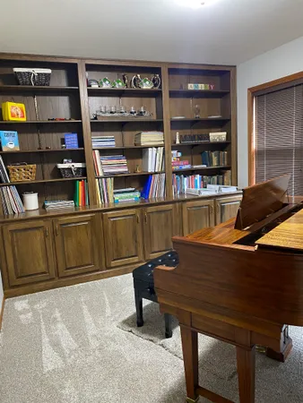 a view of a workspace with furniture
