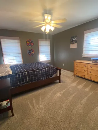 a view of a livingroom with furniture and windows
