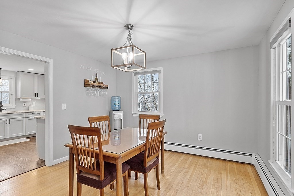 75 Stark Road Derry, NH 03038 - Photo 8 of 39 a view of a dining room with furniture wooden floor and chandelier