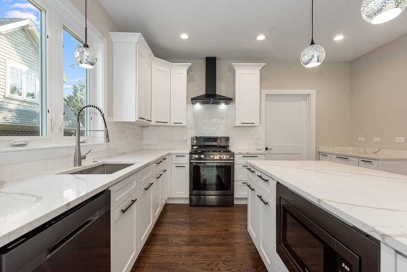 5700 Wolf Road Western Springs, IL 60558 - Photo 13 of 39 a kitchen with a sink stove and cabinets