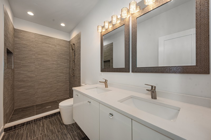 5700 Wolf Road Western Springs, IL 60558 - Photo 17 of 39 a bathroom with a double vanity sink mirror and toilet