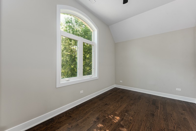 5700 Wolf Road Western Springs, IL 60558 - Photo 28 of 39 an empty room with wooden floor and windows