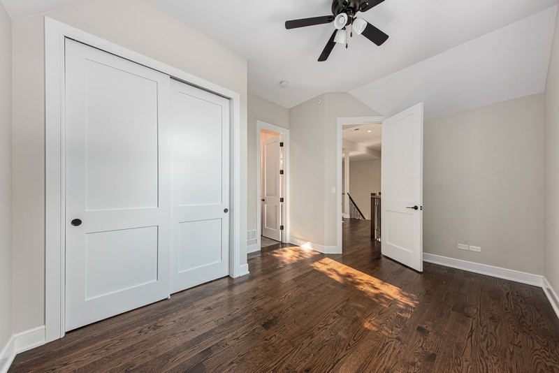 5700 Wolf Road Western Springs, IL 60558 - Photo 29 of 39 a view of a room with wooden floor and white walls