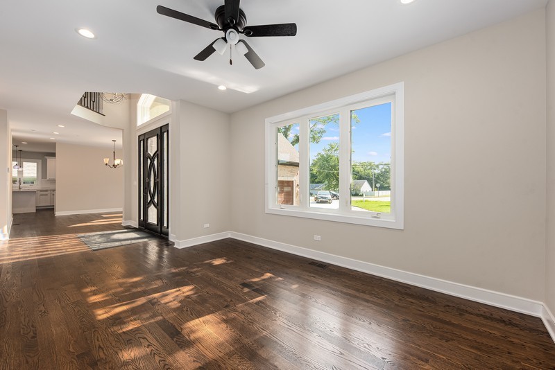 5700 Wolf Road Western Springs, IL 60558 - Photo 4 of 39 a view of an empty room with wooden floor and a window