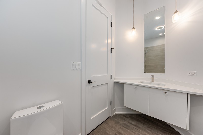 5700 Wolf Road Western Springs, IL 60558 - Photo 32 of 39 a bathroom with a sink and mirror
