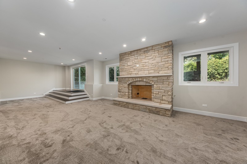 5700 Wolf Road Western Springs, IL 60558 - Photo 35 of 39 an empty room with windows and fireplace