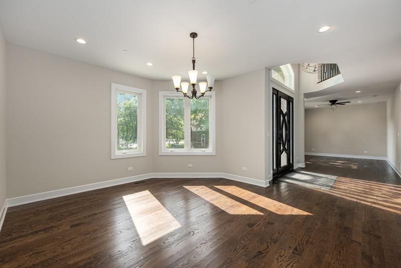 5700 Wolf Road Western Springs, IL 60558 - Photo 5 of 39 an empty room with wooden floor and windows