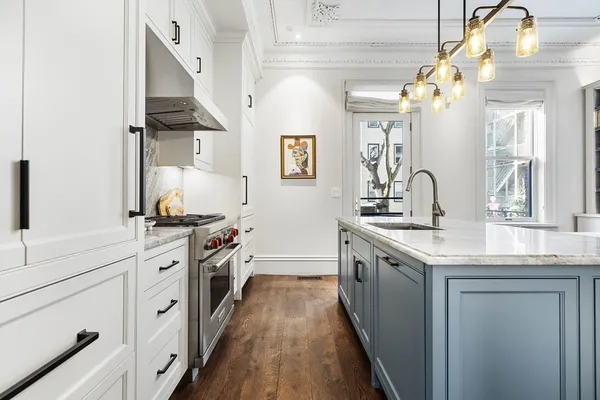 a kitchen with stainless steel appliances granite countertop a sink and stove