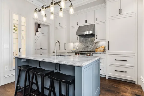 a kitchen with a sink and cabinets