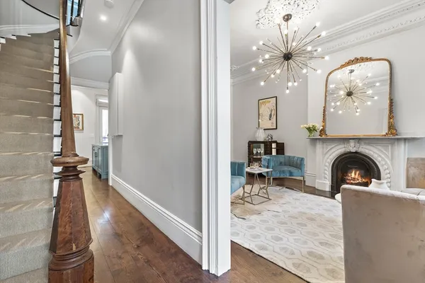a view of a livingroom with furniture and a fireplace