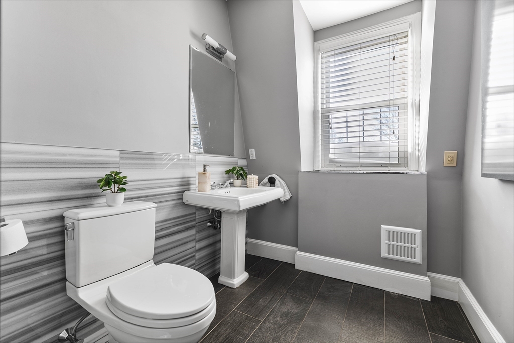 93 Third Street, Unit 93 Cambridge, MA 02141 - Photo 28 of 42 a bathroom with a sink toilet and a window