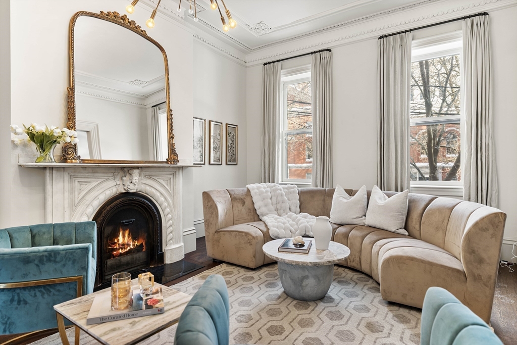 93 Third Street, Unit 93 Cambridge, MA 02141 - Photo 3 of 42 a living room with furniture and a fireplace
