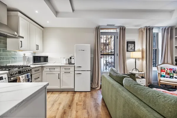 a living room with furniture and flat screen tv