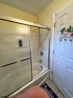 a bathroom with a tub and a shower