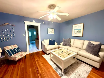 a living room with a bed and a couch