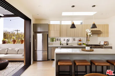 a kitchen with a sink cabinets and window