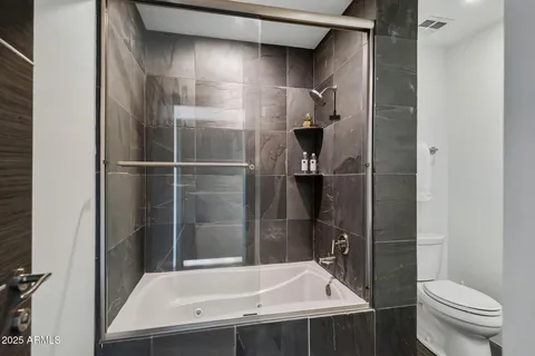 a bathroom with a sink and toilet