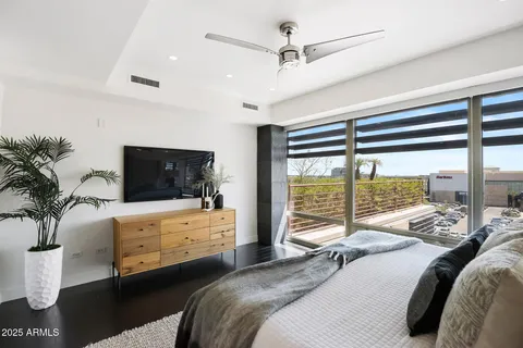 a bedroom with a bed and a couch