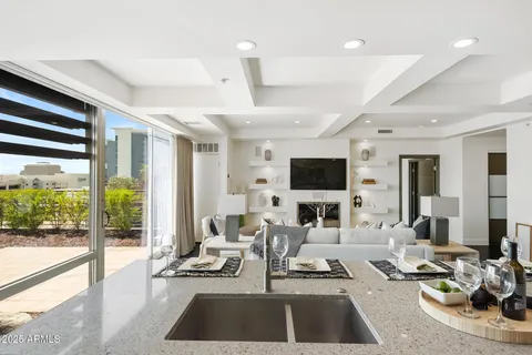 a living room with furniture flat screen tv and a fireplace
