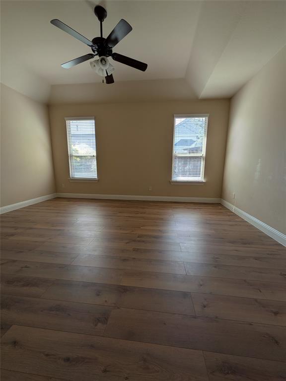 820 Callcott Street McKinney, TX 75072 - Photo 15 of 22 a view of room window and wooden floor