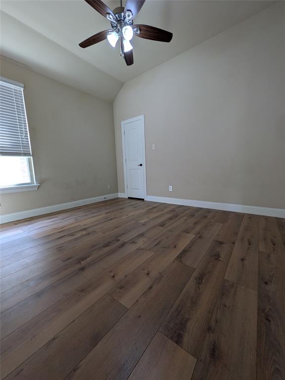 820 Callcott Street McKinney, TX 75072 - Photo 17 of 22 an empty room with wooden floor and windows
