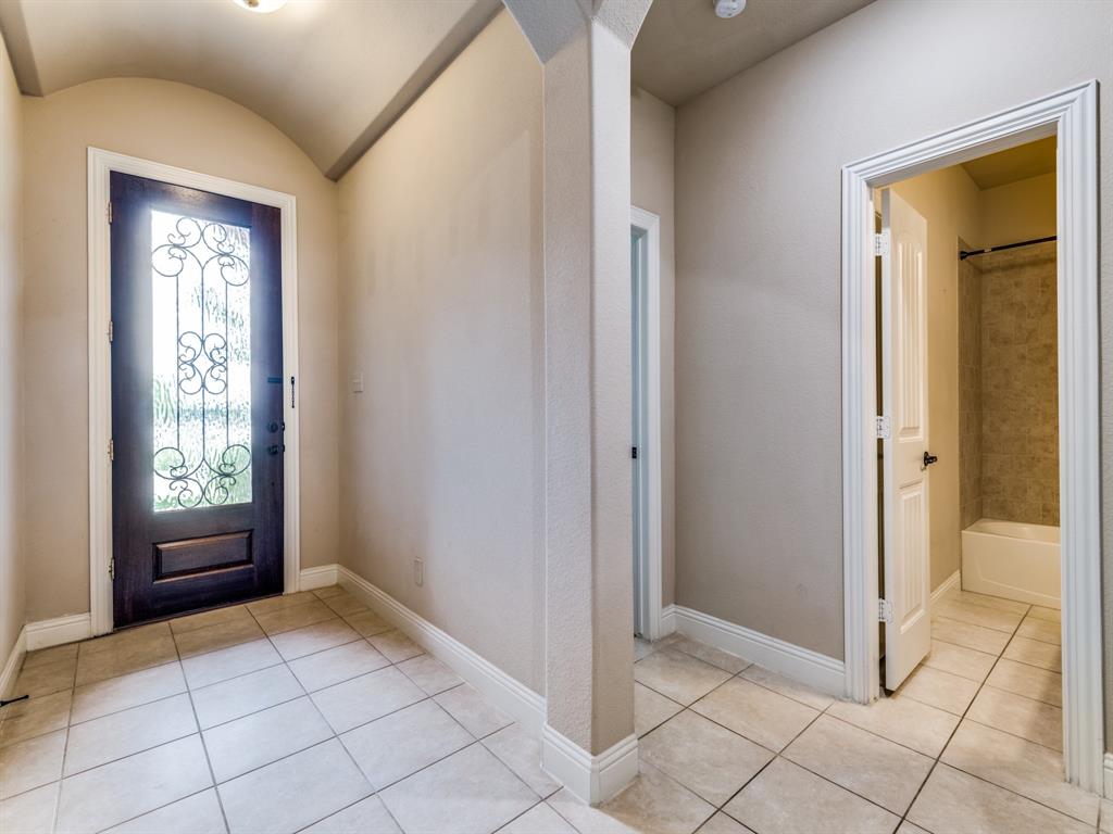 820 Callcott Street McKinney, TX 75072 - Photo 3 of 22 a view of an entryway and a window