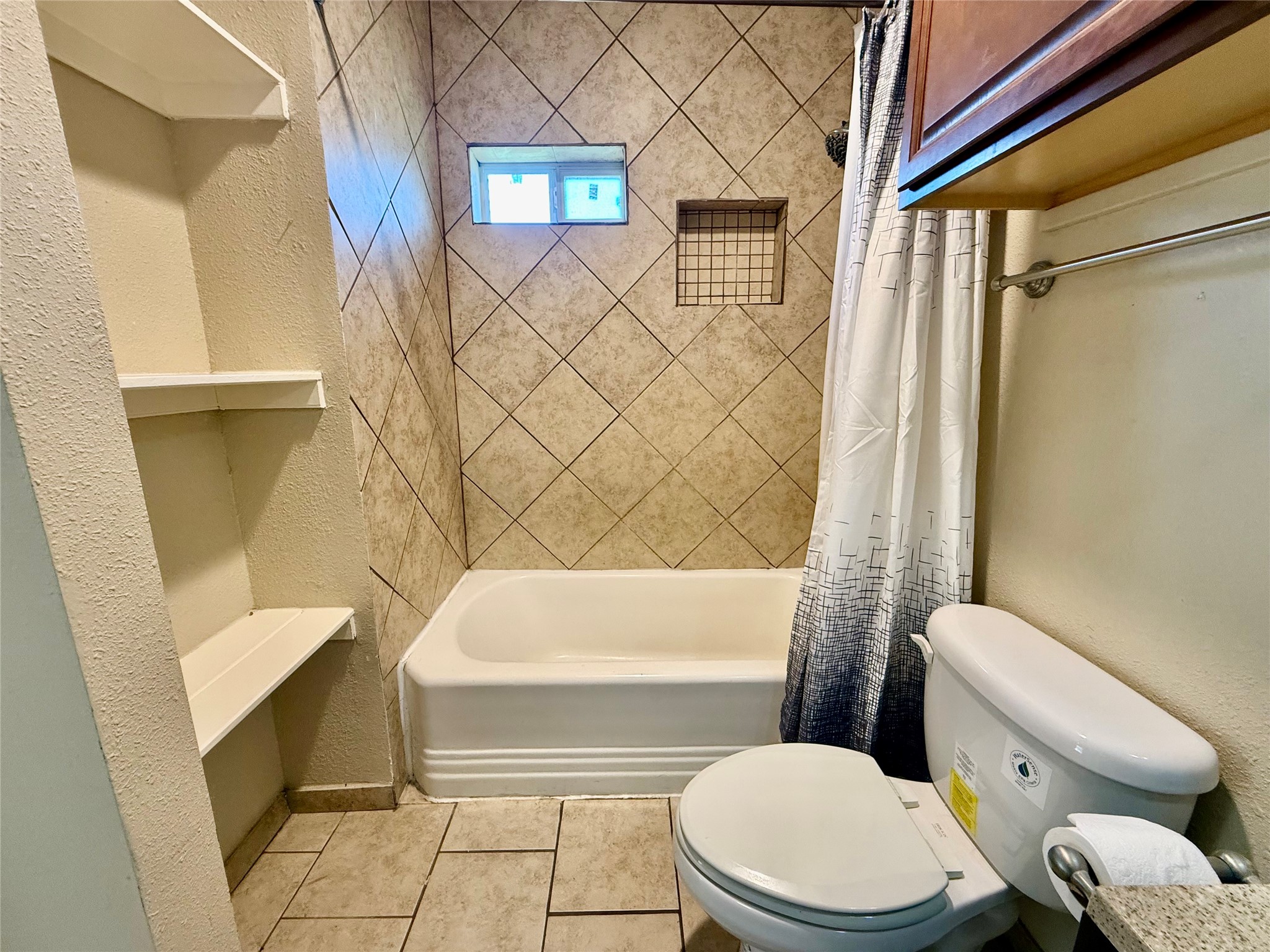 429 West 2nd Street Freeport, TX 77541 - Photo 17 of 49 a white toilet sitting next to a bath tub and a shower