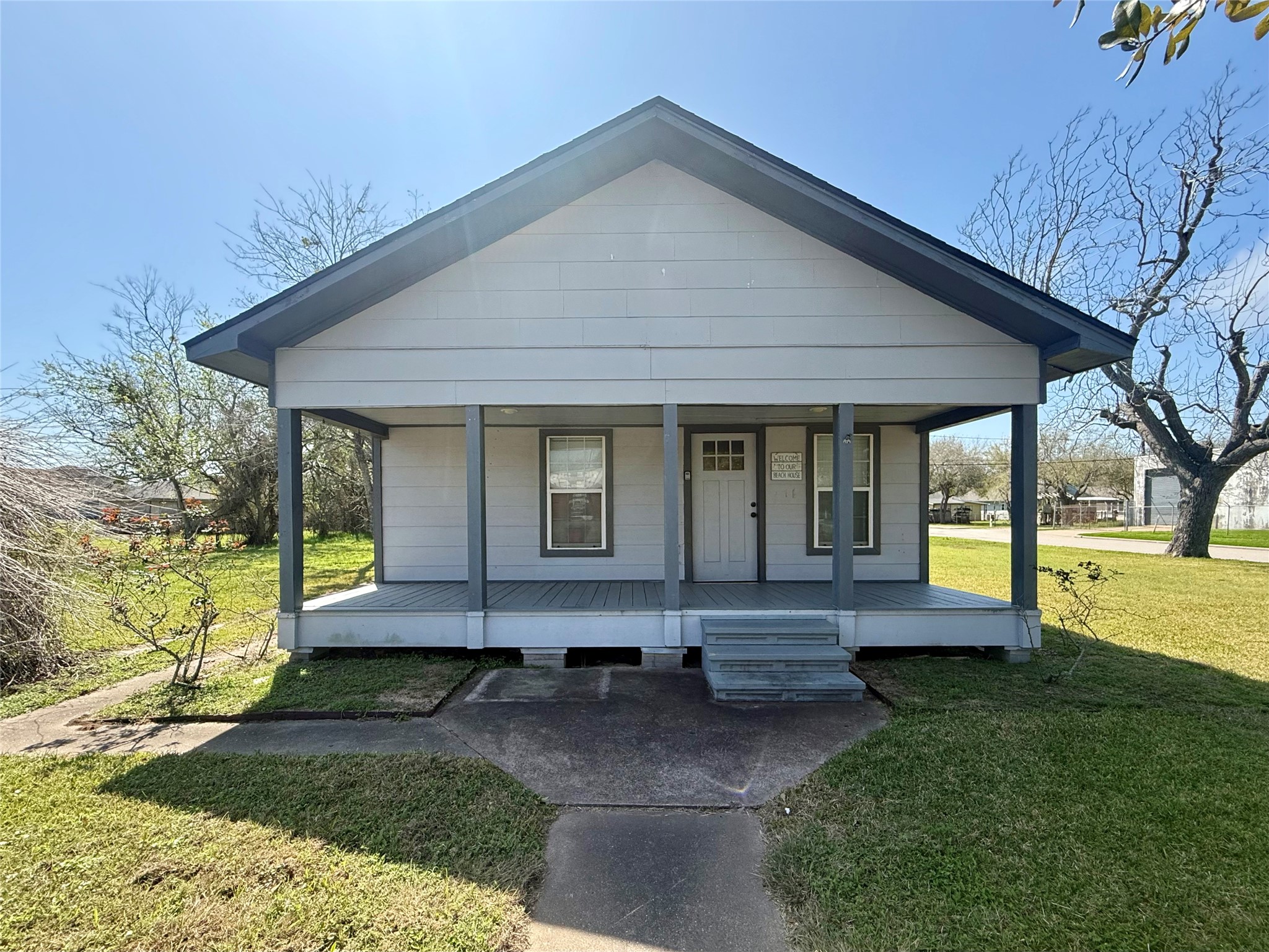 429 West 2nd Street Freeport, TX 77541 - Photo 2 of 49 a front view of a house with a yard
