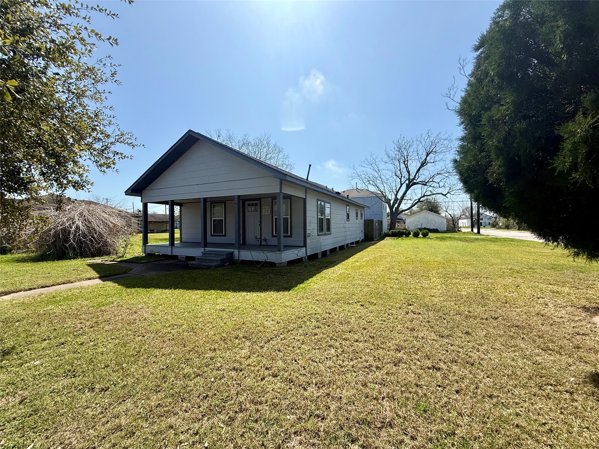 429 West 2nd Street Freeport, TX 77541 - Photo 49 of 49 a view of a house with swimming pool and yard with green space
