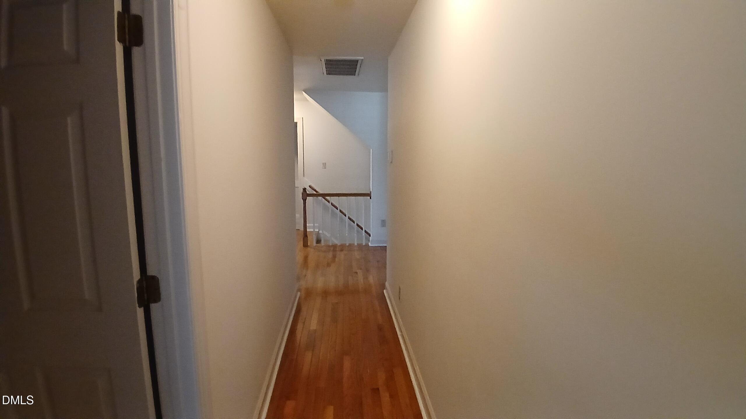 1817 Thorpshire Drive Raleigh, NC 27615 - Photo 28 of 36 a view of a hallway with wooden floor