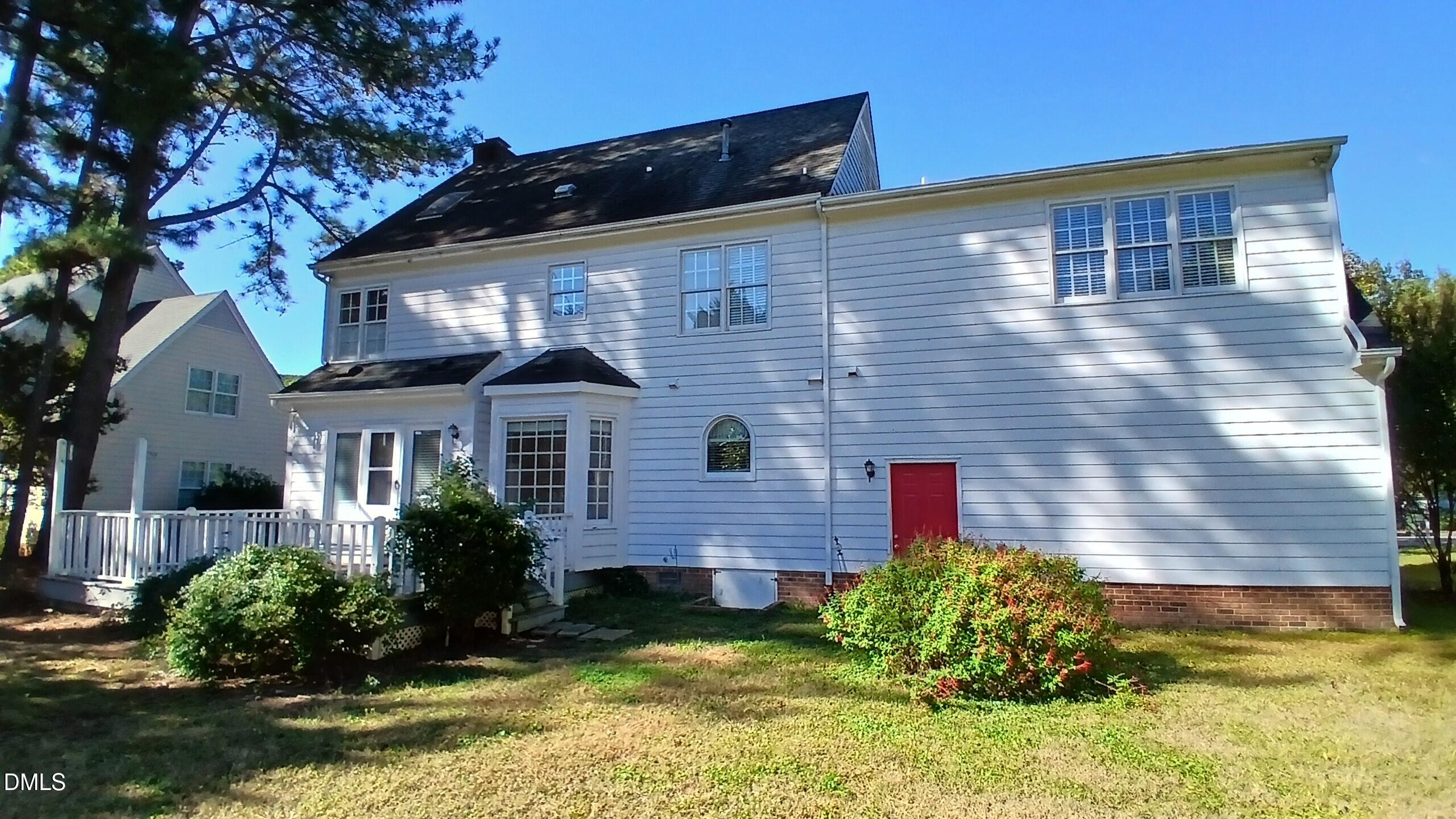 1817 Thorpshire Drive Raleigh, NC 27615 - Photo 3 of 36 a front view of a house with garden