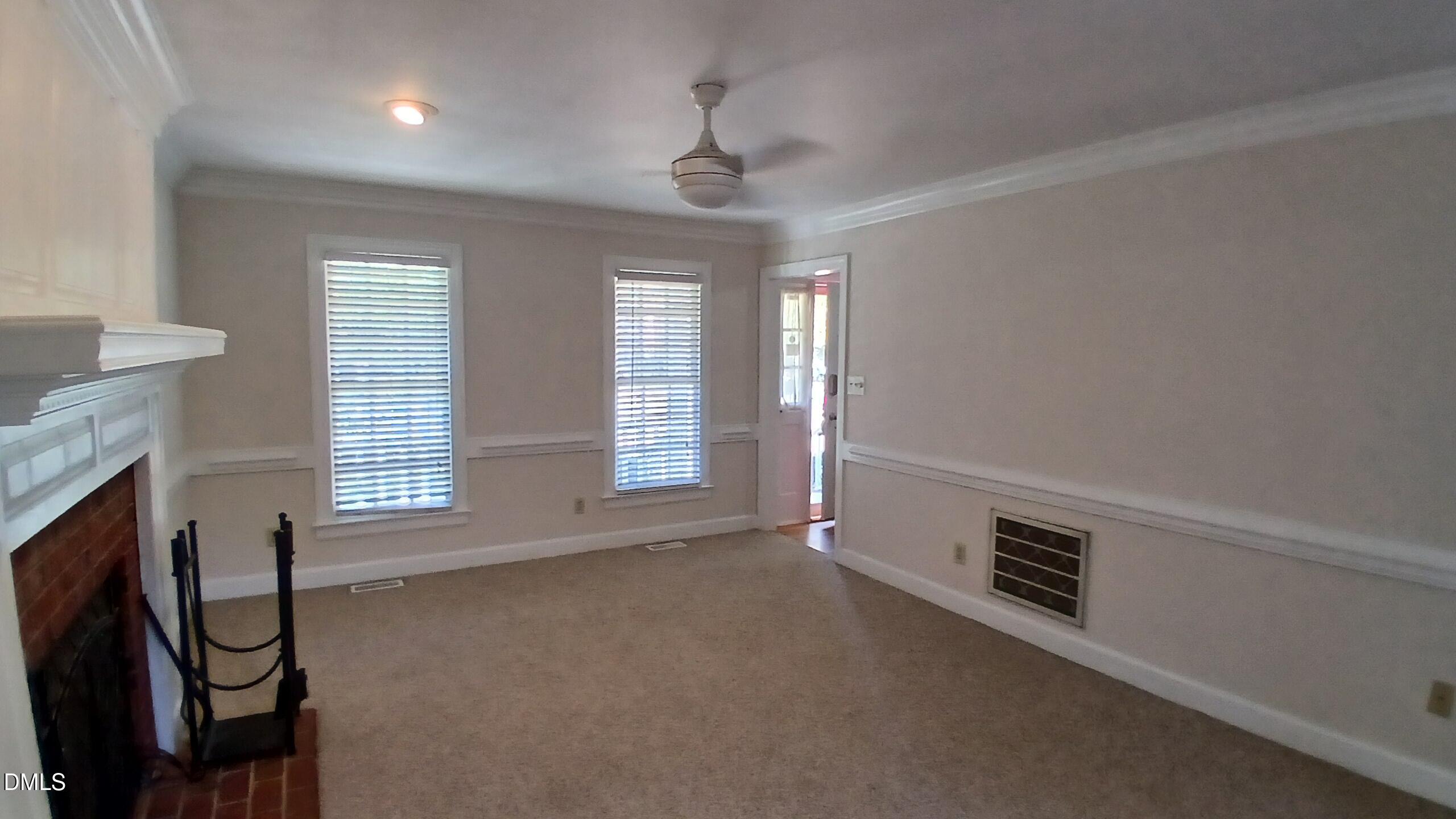 1817 Thorpshire Drive Raleigh, NC 27615 - Photo 8 of 36 a view of an empty room with a window