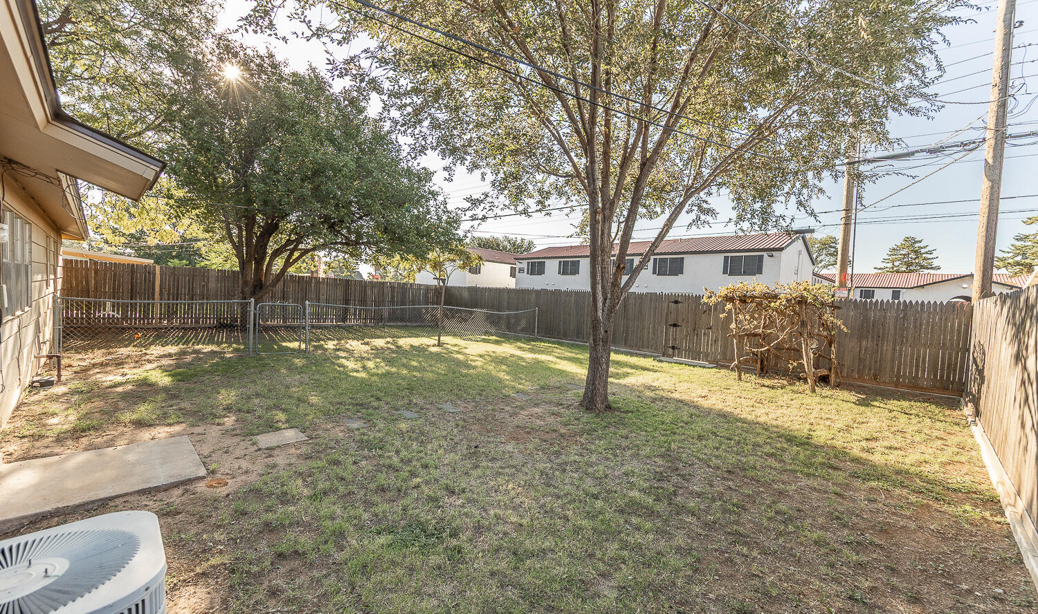 5405 49th Street Lubbock, TX 79414 - Photo 22 of 25 a view of a yard with a tree