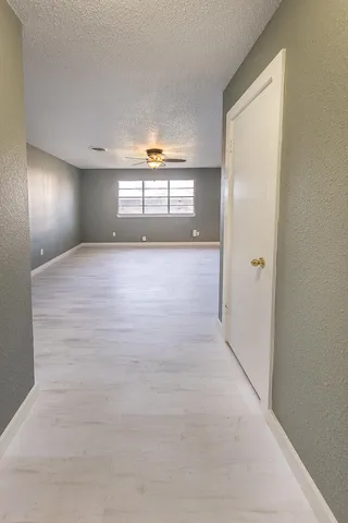 a view of an empty room and window