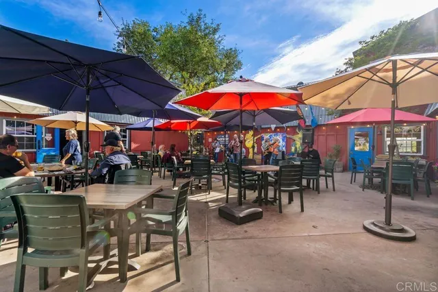 a view of a chairs and tables in the balcony