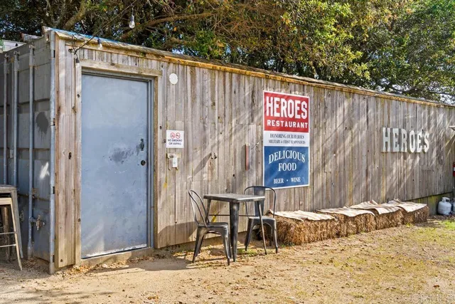 a view of a livingroom with furniture window and fireplace