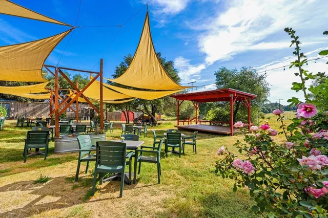 a view of swimming pool with sitting area