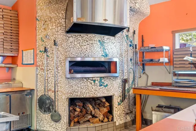 a outdoor dining space with lots of tables and chairs