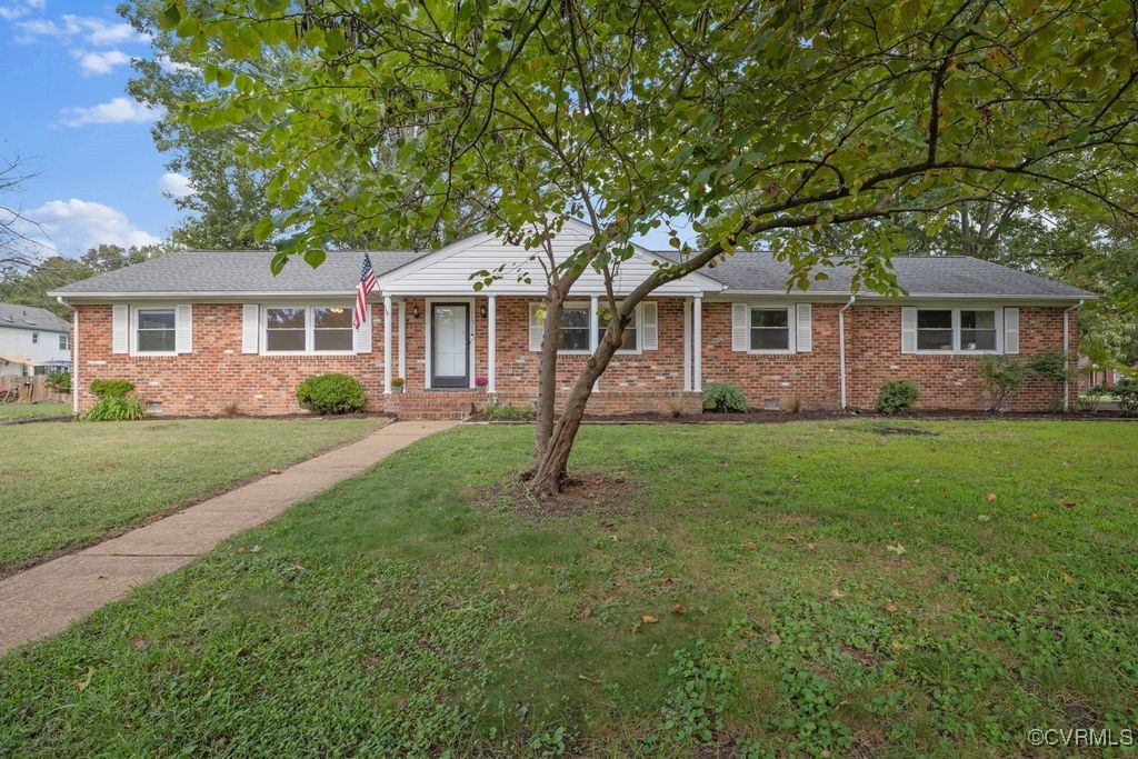11511 Rochelle Road Chester, VA 23831 - Photo 1 of 32 a front view of house with yard and green space