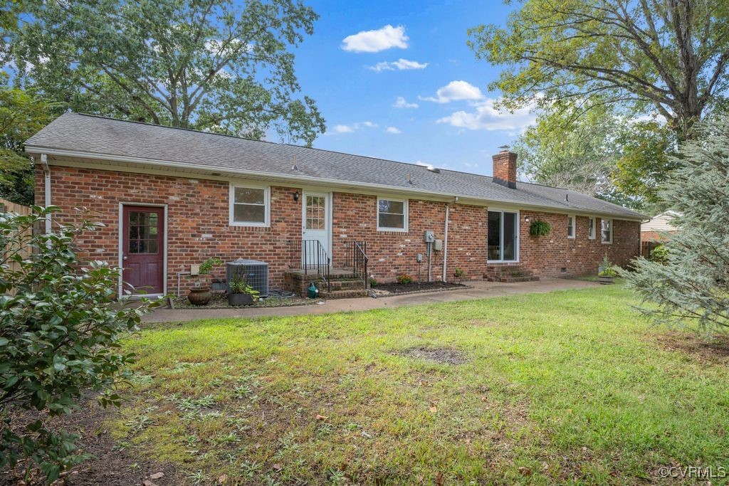 11511 Rochelle Road Chester, VA 23831 - Photo 11 of 32 a backyard of a house with seating space