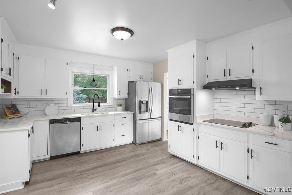 11511 Rochelle Road Chester, VA 23831 - Photo 19 of 32 a kitchen with white cabinets and white appliances