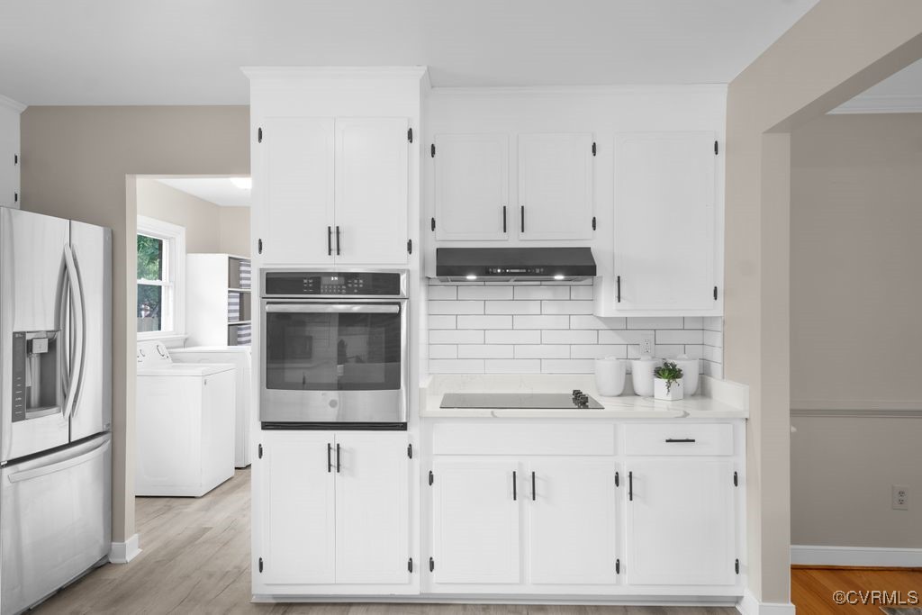 11511 Rochelle Road Chester, VA 23831 - Photo 21 of 32 a kitchen with stainless steel appliances a refrigerator and white cabinets