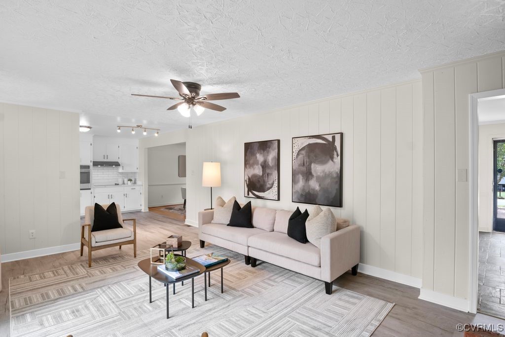 11511 Rochelle Road Chester, VA 23831 - Photo 25 of 32 a living room with furniture and a rug